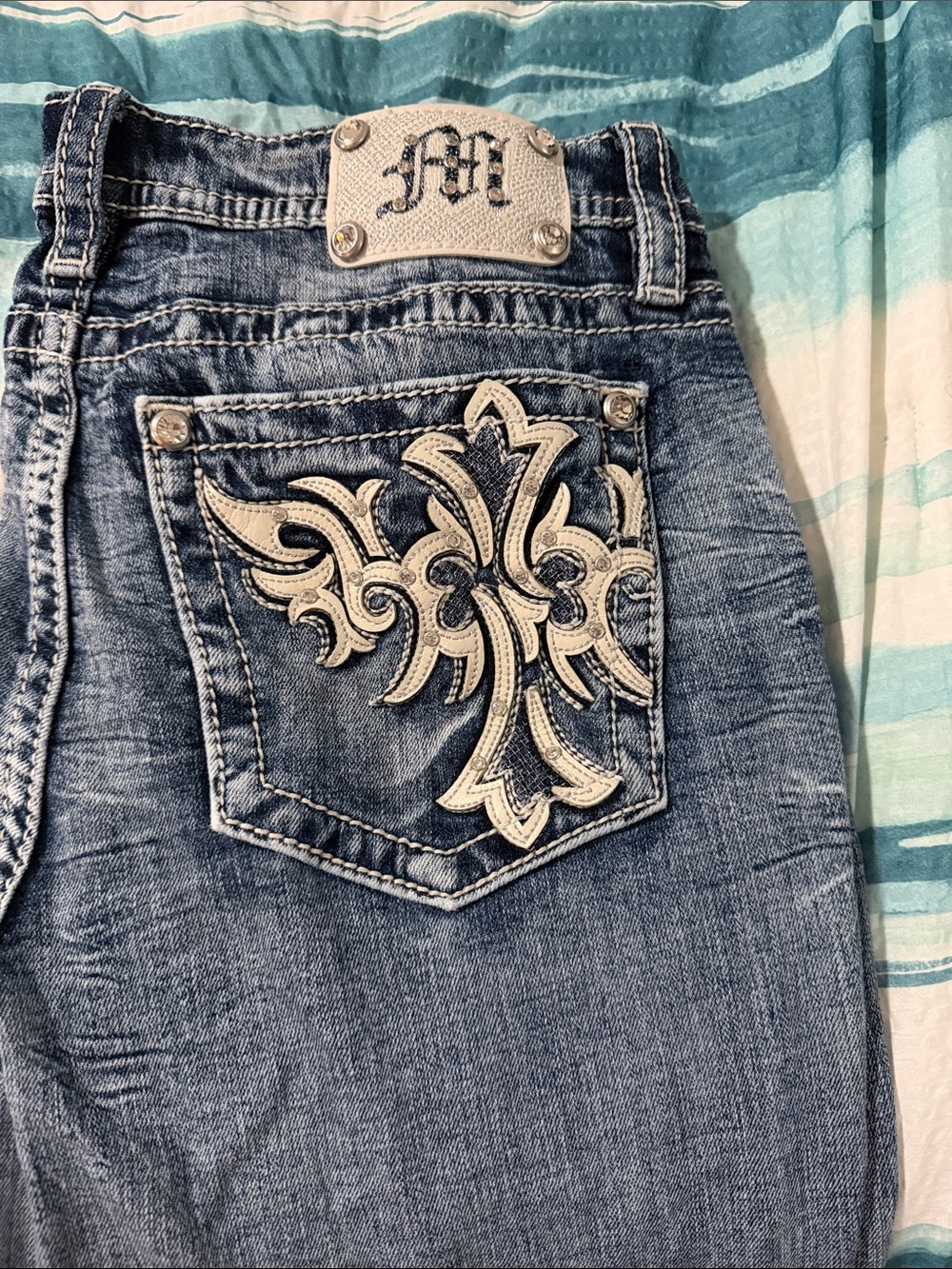 Miss Me Blue Denim Bootcut Jeans with White Embroidered Fleur-de-Lis Pocket